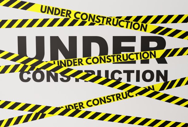 黄色和黑色警告条纹，铭文正在建设中。图片下载