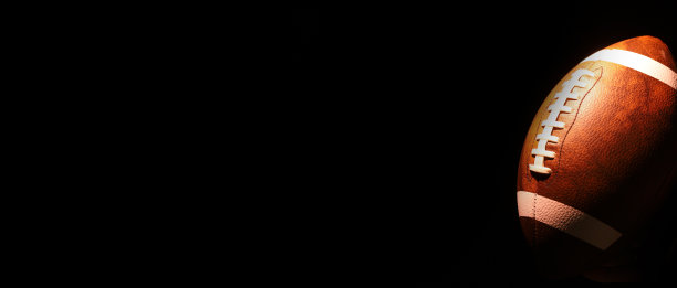 美式足球的黑色背景球。美国的游戏。副本的空间。图片下载