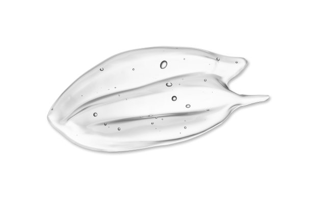 化妆品精华液美容凝胶色块涂抹涂抹在蓝色背景。泡沫质地的护肤美容产品图片下载