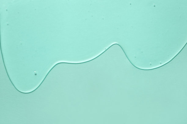 美容精华凝胶美在薄荷绿色背景。泡沫质地的护肤美容产品图片下载