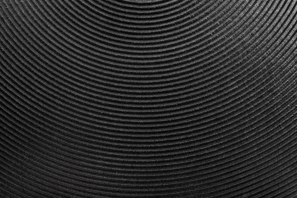 电炉加热盘纹理宏。固体金属加热元件的热板灶台特写。背景为黑色电炉表面烹饪。图片下载