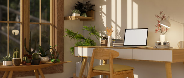 舒适最小的家庭办公室工作室内的侧面视图与笔记本电脑模型在木桌上图片下载
