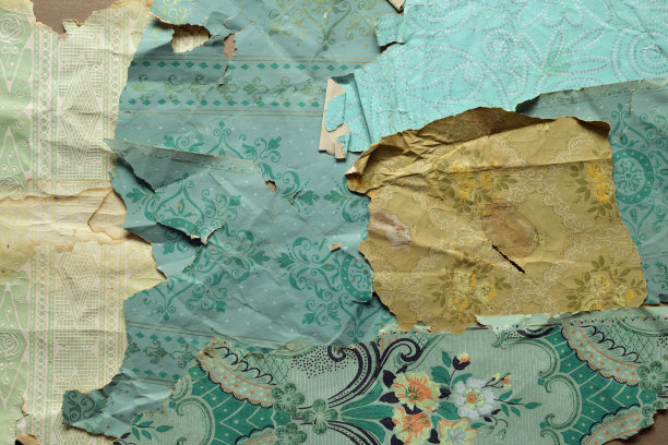 墙上的旧墙纸。旧墙纸的纹理或背景。图片下载