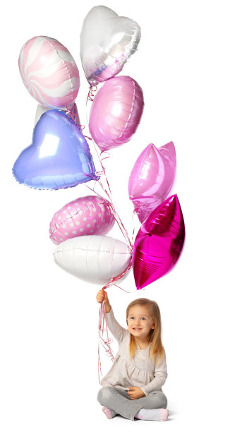 小女孩拿着一堆气球孤立地坐在白色背景上图片下载