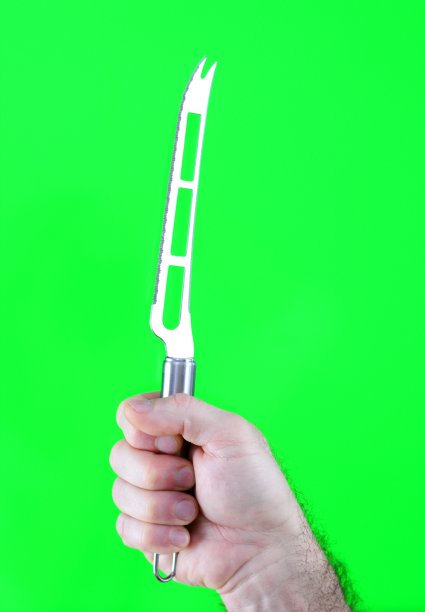 菜刀，绿色背景上有男人多毛的手上有洞图片下载