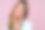 照片中可爱的年轻女模特双手轻触下巴，微笑温柔，面容柔美，长发梳在右侧，画着专业的妆容，紫色背景下孤立图片下载