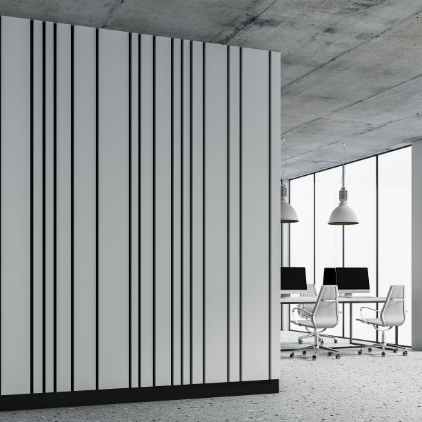 半空的办公室内部侧视图，内有复印空间，办公桌放在水磨石地板和白色镶板墙上图片下载