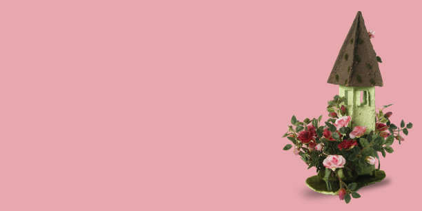 装饰城堡形状的花盆在粉红色的背景与文字空间图片下载