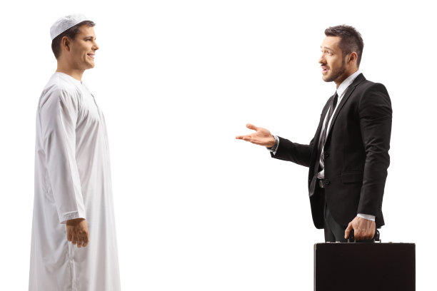 一名阿拉伯男子正在与一名拿着公文包的商人交谈图片下载