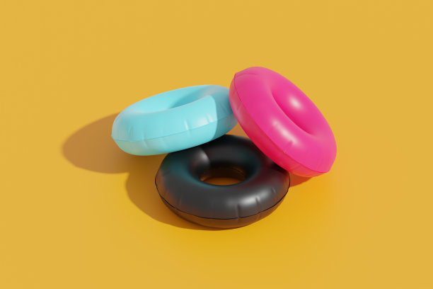 充气游泳管在明亮的背景，3d渲染。色彩鲜艳的游泳圈，夏日、假期和海上度假的概念图片下载