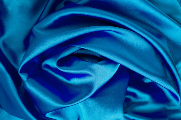 纺织品的背景。蓝色的丝绸。特写镜头。前视图。图片下载