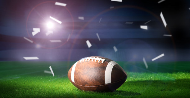 美式足球在运动场上的用球。美国的游戏。副本的空间。图片下载