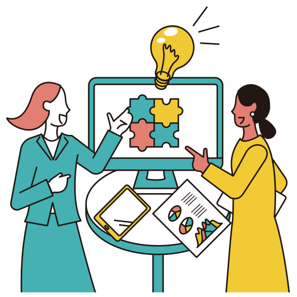 一个女商人和一个印度女人在显示器前谈生意图片下载