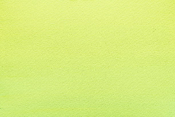 明亮的绿色水彩画在纸的背景。图片下载