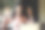 年轻兴奋的非裔美国妇女的肖像坐在桌子旁的咖啡馆笔记本电脑，举手，表示胜利。图片下载