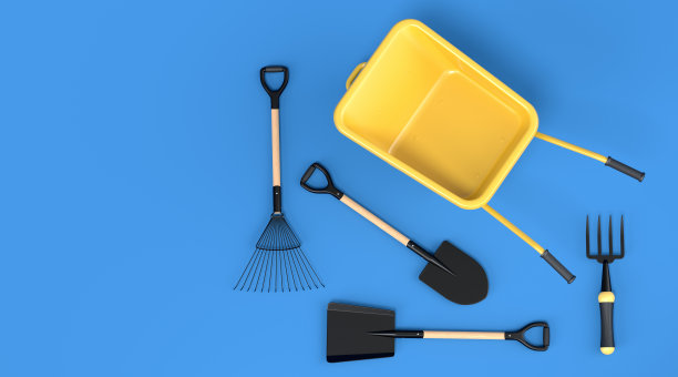 花园手推车与花园工具，如铲子，耙子和叉子在蓝色图片下载