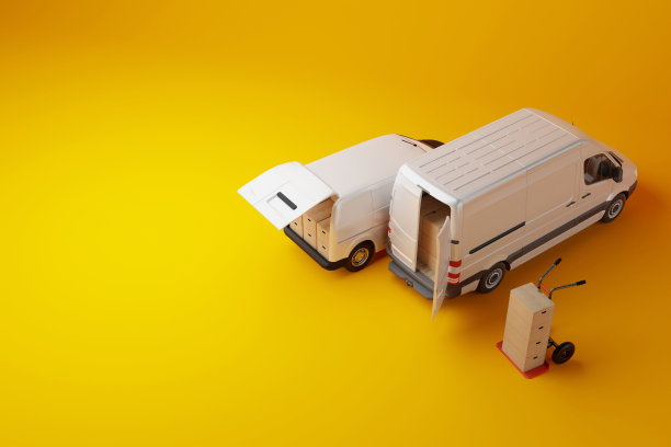 两辆白色商业货车，黄色背景的纸箱。图片下载