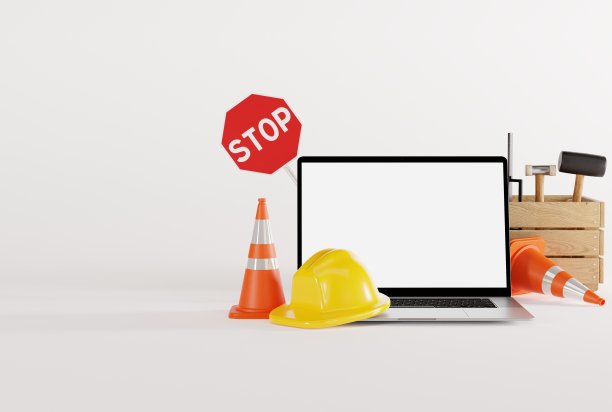 笔记本电脑和施工工具，头盔，锥筒。图片下载