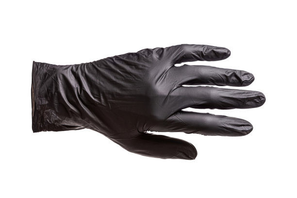 黑色橡胶手套戴在手上，手的外侧图片下载