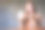 一个年轻女子拿着、展示并指着一部手机的模型图，手机的屏幕是空白的图片下载