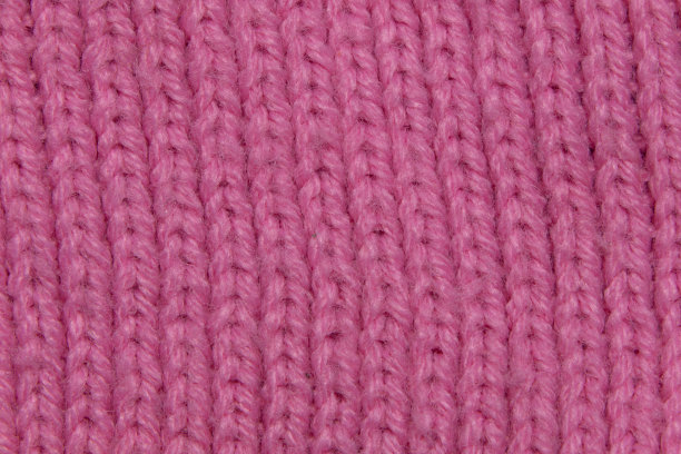 粉色背景纹理-微距照片针织羊毛织物图片下载