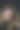 一个美丽的微笑金发女人的肖像安排她的头发在运动与她的手图片下载