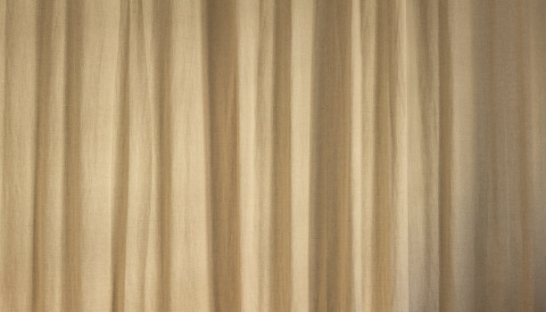 米色天然亚麻窗帘背景。美丽的室内家居设计背景。宽悬垂的棉织物质地图片下载