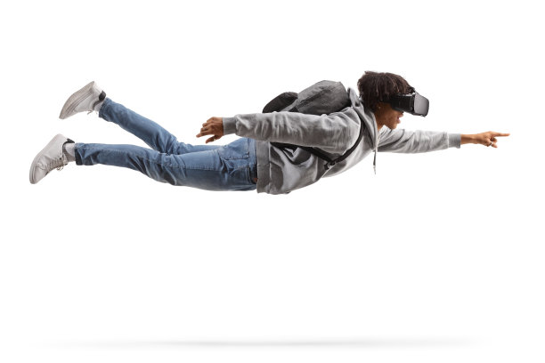 一名非裔美国男学生戴着vr头盔飞行的完整镜头图片下载