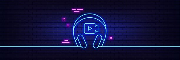 耳机与视频摄像头线图标。在线会议签名。霓虹灯发光效果。向量图片下载