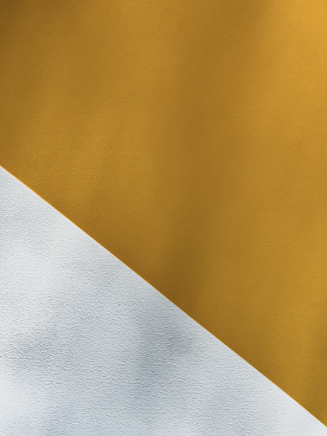 黄色和白色的纸。抽象的背景图片下载