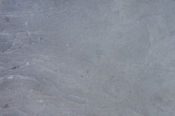 天然石材的纹理。天然石材表面地板或墙壁装饰。灰色石头的样本，内部有波浪图案图片下载