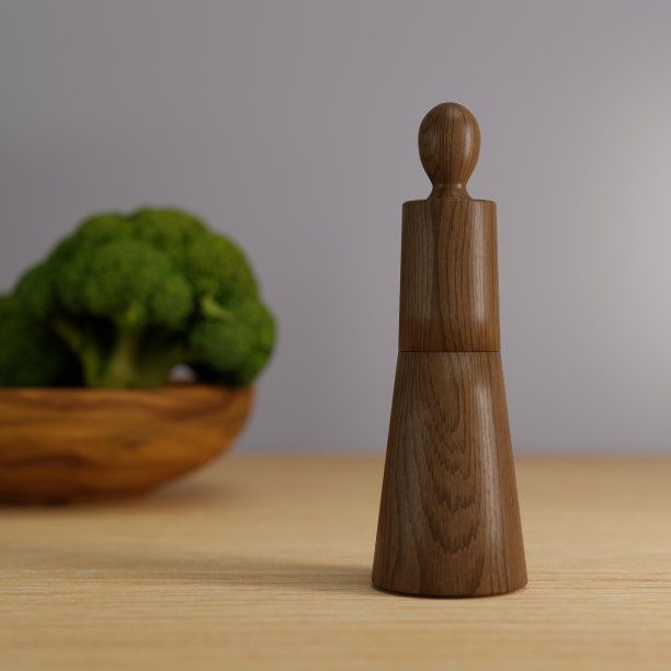 3D渲染木胡椒研磨机在餐桌上，木胡椒G图片下载