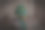 一个绿色眼睛的恐龙玩具的特写图像图片下载