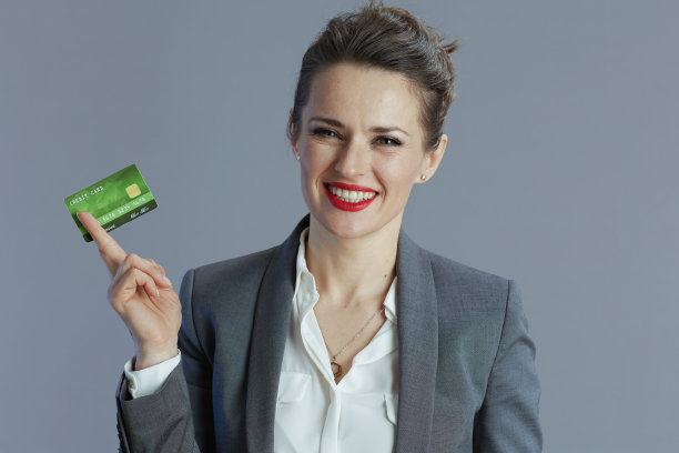 微笑的现代女工孤立在灰色图片下载