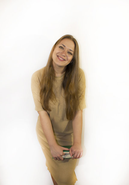 年轻漂亮的女人带着书，课本图片下载