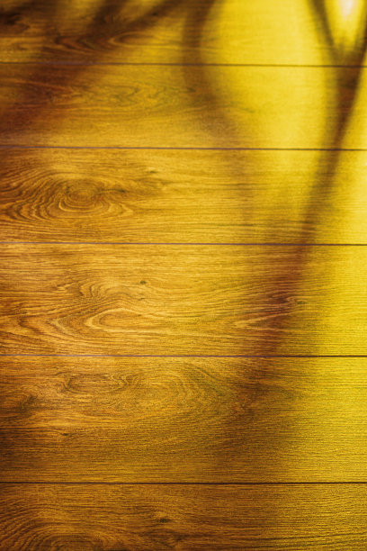 阳光和阴影投射在木地板上。木制背景图片下载