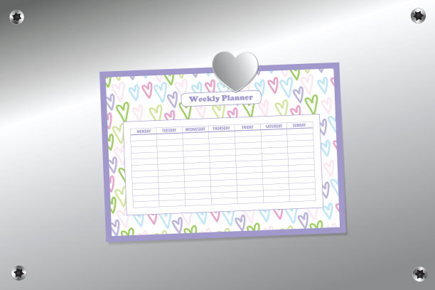 每周计划模板与银心形磁铁在银针板背景表面与托克斯螺丝图片下载