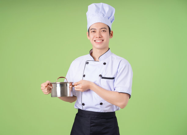 年轻的亚洲男性厨师的背景照片图片下载
