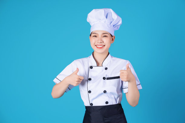 年轻的亚洲女厨师的背景肖像图片下载