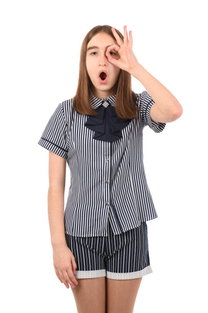 年轻漂亮的女孩穿着白色背景的校服图片下载