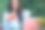 一名女子坐在街边咖啡馆边喝冷饮边用笔记本电脑图片下载