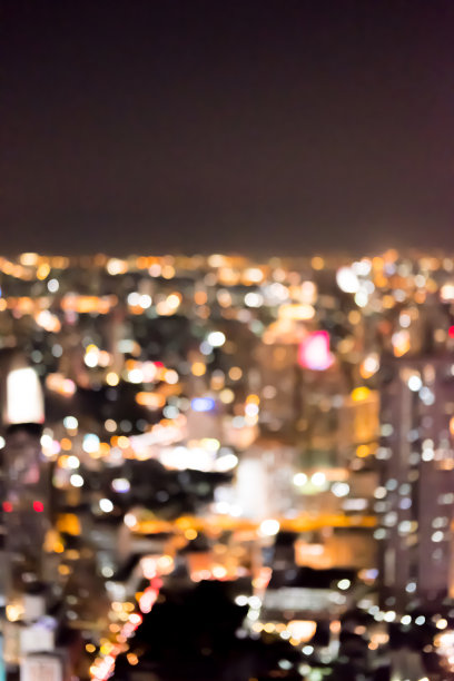 曼谷城市景观的模糊图像，在泰国商业区的夜景。图片下载
