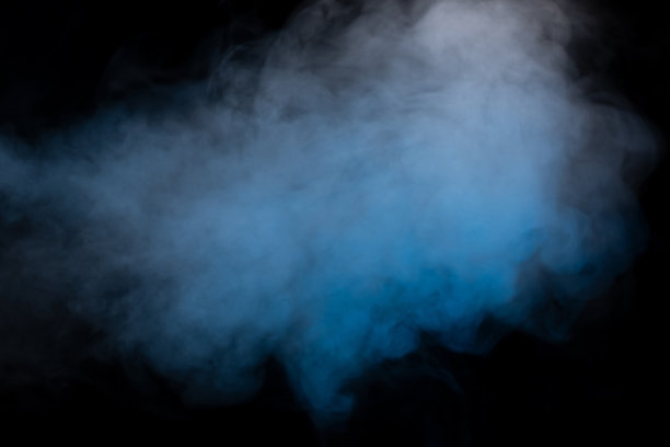 黑色背景上有蓝色和黄色的蒸汽。图片下载