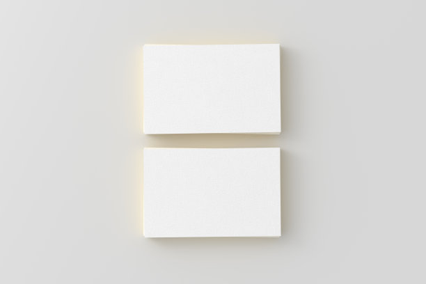 名片与黄金装饰模型。两叠白色背景的名片。正上方视图图片下载