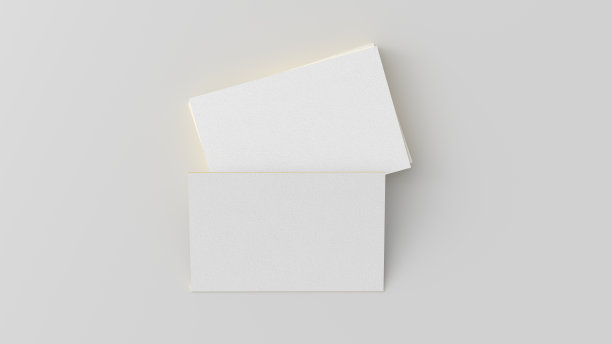 名片与黄金装饰模型。一叠白色背景的名片。正上方视图图片下载