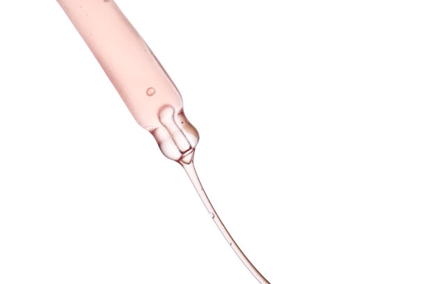 移液管有粘稠的粉红色化妆品特写。图片下载