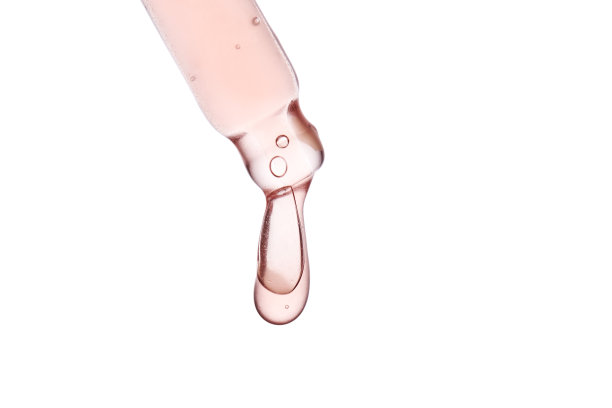 移液管有粘稠的粉红色化妆品特写。图片下载