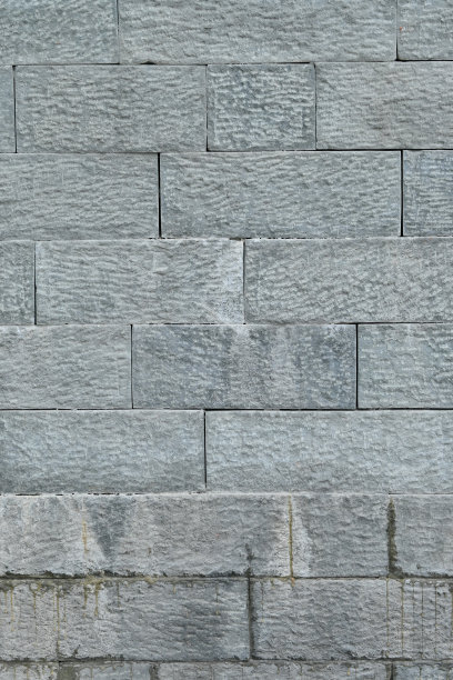 特写一束灰棕色石墙柔和聚焦自然灰棕色背景。特写一束灰棕色石墙柔和聚焦自然灰棕色背景。图片下载