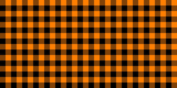 条纹无缝图案。黑色和橙色维希背景纹理。格子花呢格子重复壁纸。织物的设计。向量图片下载
