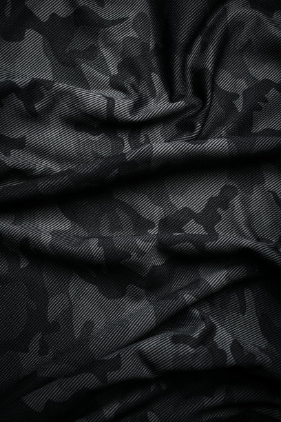 迷彩图案。时髦的深灰色迷彩面料。军事上的纹理。黑暗的背景。图片下载